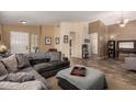 Spacious living room with neutral colors and modern tile floors with multiple seating areas at 4038 E Wrangler Ct, Gilbert, AZ 85297