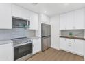 Bright kitchen featuring stainless steel appliances, subway tile backsplash and ample storage at 4201 E Camelback Rd # 70, Phoenix, AZ 85018