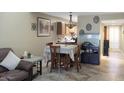 Cozy dining area with a table set for four next to the open kitchen at 4718 W Sanna St, Glendale, AZ 85302