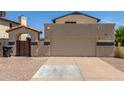 Two-car garage in a charming home with an arched side entrance at 619 E Jensen St # 34, Mesa, AZ 85203