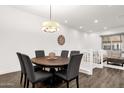 Cozy dining area with a round table and seating for six, bathed in natural light at 6565 E Thomas Rd # 1096, Scottsdale, AZ 85251