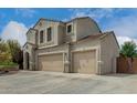 Beautiful home with a three-car garage, desert landscaping, and a welcoming exterior at 887 W Santa Gertrudis Trl, San Tan Valley, AZ 85143