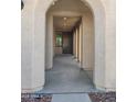 Welcoming entryway featuring arched openings, recessed lighting, and a view to the front door at 9137 W Sells Dr, Phoenix, AZ 85037