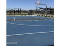 Community basketball court with modern black metal shade structures and seating at 15515 W Deanne Dr, Waddell, AZ 85355