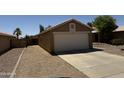 Charming single-story home with a well-maintained gravel front yard and a two-car garage, perfect for a Gathering at 15729 W Lundberg St, Surprise, AZ 85374