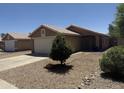 Charming single-story home with a well-maintained front yard and a two-car garage, perfect for a Gathering at 15729 W Lundberg St, Surprise, AZ 85374