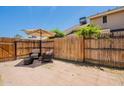 Private backyard with patio, umbrella, and seating area perfect for relaxation at 2455 E Broadway Rd # 115, Mesa, AZ 85204