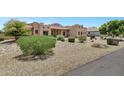 Southwestern home featuring drought-tolerant landscaping and beautiful desert shrubbery at 24615 S 182Nd Pl, Gilbert, AZ 85298