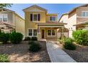 Inviting two-story home features a covered porch and a meticulously landscaped yard at 3085 E Camellia Dr, Gilbert, AZ 85296