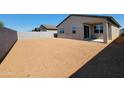 Large, blank canvas backyard awaiting your custom design with block wall providing privacy at 3557 E Audrey Dr, San Tan Valley, AZ 85143
