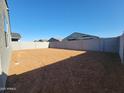 Large backyard enclosed by block wall, perfect for creating a private and personalized outdoor space at 3660 E Audrey Dr, San Tan Valley, AZ 85143