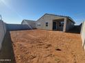 Spacious backyard with potential for custom landscaping and outdoor living, enclosed by a block wall at 3660 E Audrey Dr, San Tan Valley, AZ 85143