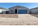 Single-story home showcasing a blue garage door, efficient landscaping, and a well-maintained front yard at 3660 E Audrey Dr, San Tan Valley, AZ 85143