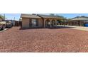 Cozy home featuring desert rock landscaping and covered parking at 4624 S Fair Ln, Tempe, AZ 85282