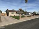 Attractive home featuring a modern yard, privacy fence, and convenient carport at 538 E Glade Ave, Mesa, AZ 85204