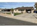 Inviting home with carport, well-kept lawn, and modern updates at 538 E Glade Ave, Mesa, AZ 85204