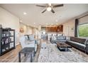 Open concept living area with modern furnishings, wood-look flooring, and seamless flow to kitchen at 6145 E Cave Creek Rd # 203, Cave Creek, AZ 85331