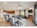 Spacious living room featuring a fireplace, comfortable seating, and open layout to the kitchen at 6145 E Cave Creek Rd # 203, Cave Creek, AZ 85331