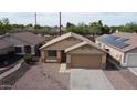 Aerial view of the home showcasing its roof, landscaping, and position in the neighborhood at 6410 W Winslow Ave, Phoenix, AZ 85043