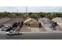 Neighborhood aerial showing the home's location among similar properties and street at 6410 W Winslow Ave, Phoenix, AZ 85043