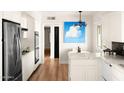 Bright kitchen featuring white cabinetry, stainless steel appliances, and stylish decor at 7508 N 13Th Ave, Phoenix, AZ 85021