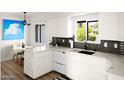 Contemporary kitchen with white cabinetry, stainless steel appliances, and modern fixtures at 7508 N 13Th Ave, Phoenix, AZ 85021