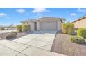 Lovely single-story home with a spacious driveway and manicured landscaping at 7580 W Darrel Rd, Laveen, AZ 85339