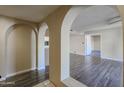 Bright living room featuring unique archways, modern flooring, and neutral paint at 10410 N Cave Creek Rd # 2220, Phoenix, AZ 85020