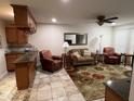 Inviting living room featuring neutral tones, tile floors, and comfortable seating at 10827 W Santa Fe Dr, Sun City, AZ 85351