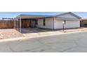 Charming single-story home with covered parking, gravel landscaping, and easy street access at 10951 N 91St Ave # 222, Peoria, AZ 85345