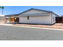 Charming single-story home with a covered carport and decorative rock landscaping at 10951 N 91St Ave # 222, Peoria, AZ 85345