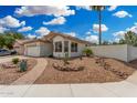 Inviting single-story home with desert landscaping, walkway, and well-manicured curb appeal at 1653 E Gail Dr, Chandler, AZ 85225