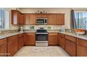 Well-equipped kitchen features stainless steel appliances, granite countertops, and ample cabinet space at 2150 W Alameda Rd # 1313, Phoenix, AZ 85085