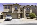 Beautiful two-story home with a two-car garage, desert landscaping, and a welcoming front entrance with unique architectural details at 25574 W Lynne Ln, Buckeye, AZ 85326