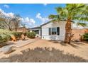 Cozy home showcasing a quaint front yard with desert landscaping and a brick paved courtyard at 2801 N 10Th St, Phoenix, AZ 85006