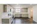 Modern kitchen boasts stainless steel appliances, granite countertops, and a stylish backsplash at 3017 N 46Th Dr, Phoenix, AZ 85031