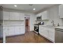 Updated kitchen with stainless steel appliances, white cabinets, and new countertops at 3841 N 21St Ave, Phoenix, AZ 85015