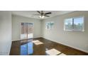 Bright living room with large windows and sliding glass doors to an outdoor space at 3841 N 21St Ave, Phoenix, AZ 85015