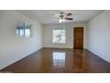 Living room featuring natural light, neutral walls, and a dark stained concrete floor at 3841 N 21St Ave, Phoenix, AZ 85015