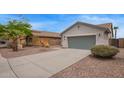A charming two story home, featuring a desert landscape, and a two car garage at 695 S 221St Dr, Buckeye, AZ 85326