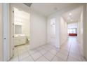 Hallway connecting the bathroom and the living areas at 7648 W Kerby Ave, Phoenix, AZ 85043