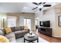 Inviting living room with a ceiling fan, sliding glass doors, and a comfortable sectional sofa at 8500 E Southern Ave # 510, Mesa, AZ 85209