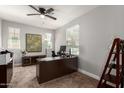Spacious home office with large desk, ample natural light, and neutral carpeting at 913 W Yosemite Dr, Chandler, AZ 85248