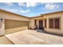 Attractive home exterior with a two-car garage and inviting front entrance at 948 E Savannah Dr, Chandler, AZ 85225