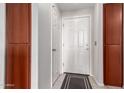 Condo entry has a white front door and built-in storage cabinets at 9820 N Central Ave # 321, Phoenix, AZ 85020