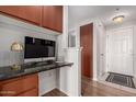 Convenient home office space with modern finishes and a stylish granite desktop at 9820 N Central Ave # 321, Phoenix, AZ 85020