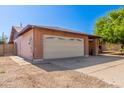 Charming single-story brick home with a two-car garage, long driveway, and low-maintenance landscaping at 10032 N 50Th Dr, Glendale, AZ 85302