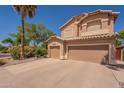 Charming two-story home features a 3-car garage, desert landscaping, and tile roof at 1125 S Larkspur St, Gilbert, AZ 85296