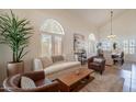 Bright living room features large windows, high ceilings, and elegant furnishings at 1125 S Larkspur St, Gilbert, AZ 85296
