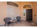 Inviting front porch with seating area, perfect for relaxing outdoors at 1125 S Larkspur St, Gilbert, AZ 85296